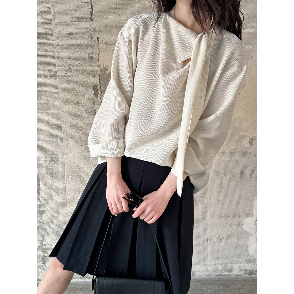 Blouse texturée à col noué élégant