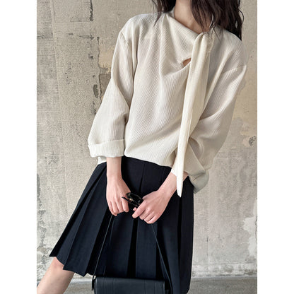 Blouse texturée à col noué élégant